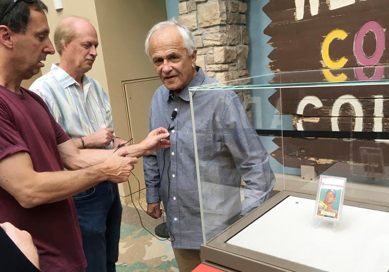 Marshall Fogell stands next to the display case containing one of the rarest baseball cards circulating, a 1952 Topps Mickey Mantle, that he owns Marshall Fogell stands next to the display case containing one of the rarest baseball cards circulating, a 1952 Topps Mickey Mantle, that he owns